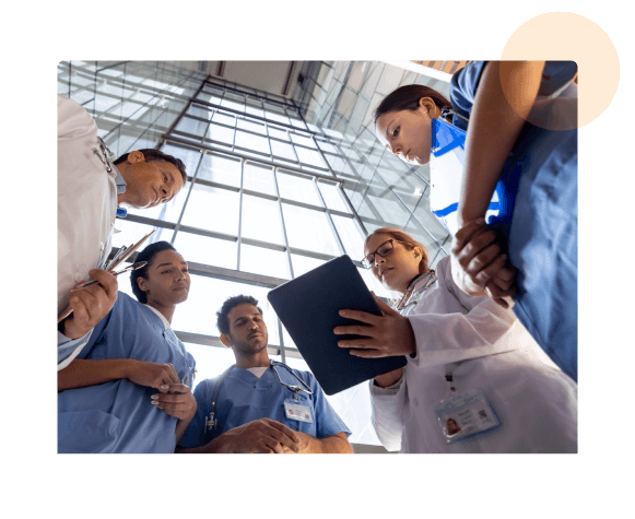 hospital-workers-looking-over-ipad (1)